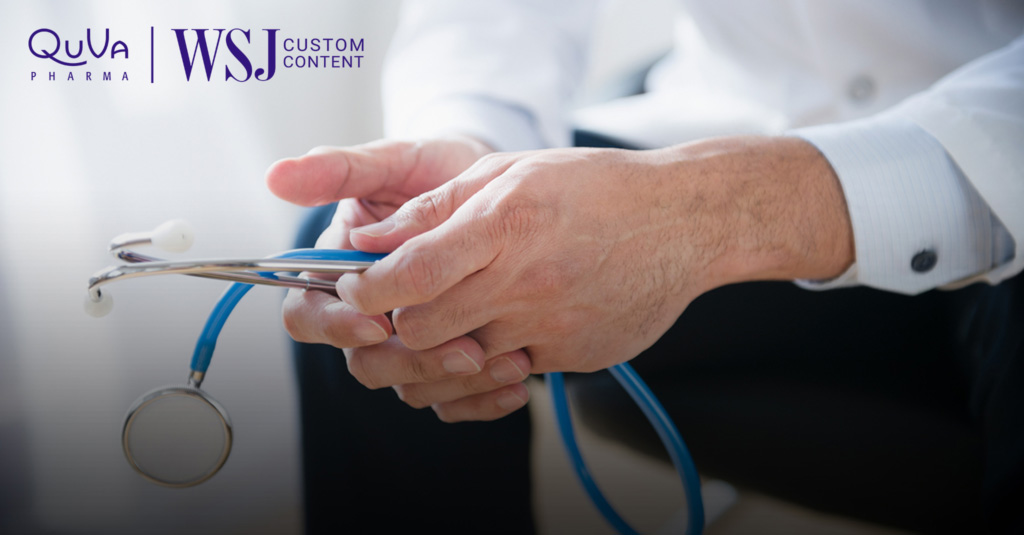 Hands of a health professional holding a stethoscope